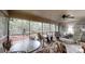Screened-in sunroom with ceiling fan, exterior views, and comfortable seating at 139 Cricket Creek Dr, Cherryville, NC 28021