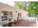 Inviting back deck overlooking lush trees with comfortable seating for relaxing outdoors at 146 Valley Glen Dr, Troutman, NC 28166