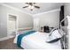 Comfortable bedroom featuring a ceiling fan and ensuite bathroom at 146 Valley Glen Dr, Troutman, NC 28166