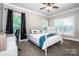 Cozy bedroom with large windows, a ceiling fan, and neutral décor at 146 Valley Glen Dr, Troutman, NC 28166
