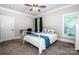 Inviting bedroom with natural light, carpet, and a ceiling fan at 146 Valley Glen Dr, Troutman, NC 28166