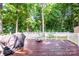 Scenic backyard deck with trees, grill, and firepit at 146 Valley Glen Dr, Troutman, NC 28166