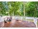 Outdoor deck space with wooded views, offering an ideal spot for entertaining at 146 Valley Glen Dr, Troutman, NC 28166