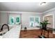 Open concept dining area with granite countertops, hardwood floors, and abundant natural light at 146 Valley Glen Dr, Troutman, NC 28166