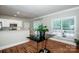 Bright dining area featuring hardwood floors, white trim, and a view of the outdoor living space at 146 Valley Glen Dr, Troutman, NC 28166