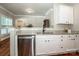 Kitchen featuring stainless steel dishwasher, granite counters and custom cabinets at 146 Valley Glen Dr, Troutman, NC 28166