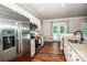 Bright kitchen featuring stainless steel appliances and access to the outdoor area at 146 Valley Glen Dr, Troutman, NC 28166