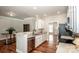 Open-concept kitchen features granite counters, stainless appliances, and custom cabinets at 146 Valley Glen Dr, Troutman, NC 28166