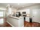 Updated kitchen featuring granite counters, white cabinets, and stainless steel appliances at 146 Valley Glen Dr, Troutman, NC 28166
