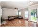 Open-concept living room with hardwood floors, natural light, and a welcoming atmosphere at 146 Valley Glen Dr, Troutman, NC 28166