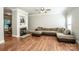 Cozy living room featuring a fireplace, hardwood floors, and a comfortable seating arrangement at 146 Valley Glen Dr, Troutman, NC 28166