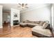 Spacious living room featuring hardwood floors, a fireplace, and a ceiling fan at 146 Valley Glen Dr, Troutman, NC 28166