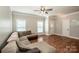 Spacious living room featuring hardwood floors, neutral walls, and an open layout at 146 Valley Glen Dr, Troutman, NC 28166