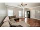 Bright living room with hardwood floors, neutral walls, and a comfortable seating area at 146 Valley Glen Dr, Troutman, NC 28166