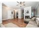 Open living space with hardwood floors, neutral walls, and a view of adjacent rooms at 146 Valley Glen Dr, Troutman, NC 28166