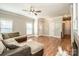 Bright and airy living room with hardwood floors, neutral walls, and multiple entry points at 146 Valley Glen Dr, Troutman, NC 28166