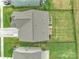 Aerial view of a fenced yard with a well-maintained lawn and adjacent homes in a residential neighborhood at 14734 Rivergate Pkwy, Charlotte, NC 28273