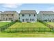 Backyard featuring well-manicured lawn surrounded by a black fence at 14734 Rivergate Pkwy, Charlotte, NC 28273