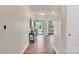 Warm entryway boasting wood floors and a glimpse into adjacent rooms enhancing the home's spacious feel at 14734 Rivergate Pkwy, Charlotte, NC 28273