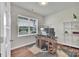 Bright home office with a large window, wood floors, and functional desk setup for remote work at 14734 Rivergate Pkwy, Charlotte, NC 28273