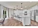 Bright kitchen featuring stainless appliances, ample countertop space, and a center island with barstool seating at 14734 Rivergate Pkwy, Charlotte, NC 28273