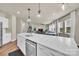 Open-concept kitchen with a large center island, quartz countertops and stainless steel appliances at 14734 Rivergate Pkwy, Charlotte, NC 28273
