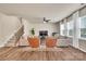 Open living room showcasing hardwood floors, large windows, and comfortable seating perfect for relaxation at 14734 Rivergate Pkwy, Charlotte, NC 28273