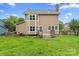 Spacious backyard featuring a wooden deck, green lawn and privacy fence at 1543 Newfound Hollow Dr, Charlotte, NC 28214