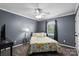 Bedroom featuring a cozy bed, bedside table, desk and window at 1543 Newfound Hollow Dr, Charlotte, NC 28214