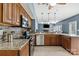 Spacious kitchen featuring stainless steel appliances, granite countertops, and wooden cabinets at 1543 Newfound Hollow Dr, Charlotte, NC 28214