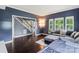 Open-concept living area with hardwood floors, a staircase, and ample natural light at 1543 Newfound Hollow Dr, Charlotte, NC 28214