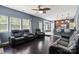 Inviting living space with a fireplace, ceiling fan, and open layout to the kitchen at 1543 Newfound Hollow Dr, Charlotte, NC 28214