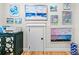 Wall with an array of art pieces and a console table at 175 Mcleod Ave, Belmont, NC 28012