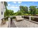 Cozy deck area with a bench and mature trees at 175 Mcleod Ave, Belmont, NC 28012