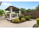 Backyard patio area with gazebo, manicured shrubbery, and mature trees at 175 Mcleod Ave, Belmont, NC 28012