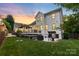 Large backyard featuring a well-manicured lawn, deck and privacy fence at 175 Mcleod Ave, Belmont, NC 28012