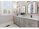 Beautiful bathroom featuring a double vanity, modern mirrors, and updated fixtures at 175 Mcleod Ave, Belmont, NC 28012