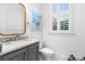 Well-lit bathroom with white cabinets and marble countertops at 175 Mcleod Ave, Belmont, NC 28012