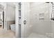 Elegant bathroom showcasing a glass shower, soaking tub, and modern tile work at 175 Mcleod Ave, Belmont, NC 28012