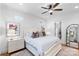 Bedroom featuring neutral decor, windows, hardwood floors, and a ceiling fan at 175 Mcleod Ave, Belmont, NC 28012