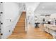 Bright entryway with hardwood floors, staircase, and modern lighting creating a welcoming atmosphere at 175 Mcleod Ave, Belmont, NC 28012