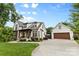 Spacious home with a three car garage, long driveway, and well-maintained landscaping at 175 Mcleod Ave, Belmont, NC 28012