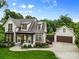 Striking exterior view highlighting the home's architecture, neat landscaping, and spacious driveway leading to a garage at 175 Mcleod Ave, Belmont, NC 28012