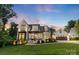 Beautiful two-story home with a landscaped yard and a detached two-car garage at 175 Mcleod Ave, Belmont, NC 28012