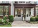 Inviting front entrance with a covered porch, elegant door, and well-manicured landscaping creates curb appeal at 175 Mcleod Ave, Belmont, NC 28012