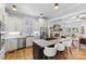 Open kitchen featuring a large island, stainless appliances, and seamless flow to the living area at 175 Mcleod Ave, Belmont, NC 28012