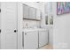 Bright laundry room with white washer and dryer at 175 Mcleod Ave, Belmont, NC 28012