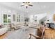 Bright living room features a fireplace, white sectional couch, and hardwood floors at 175 Mcleod Ave, Belmont, NC 28012