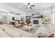 Bright living room features a fireplace, white sectional couch, and hardwood floors at 175 Mcleod Ave, Belmont, NC 28012
