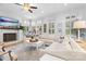 Bright living room features a fireplace, white sectional couch, and coffered ceiling at 175 Mcleod Ave, Belmont, NC 28012